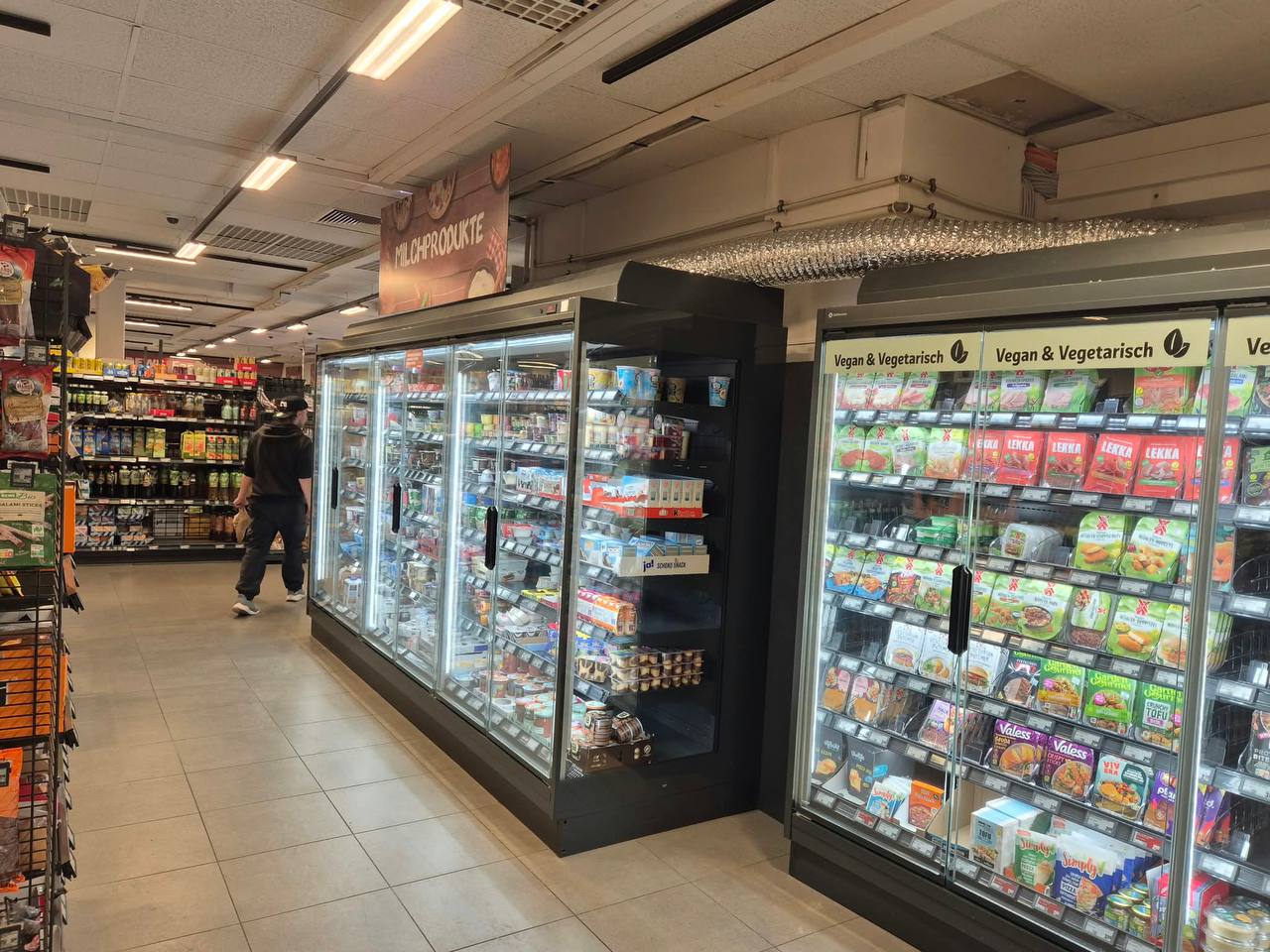 Refrigerated display cases with doors in a retail store